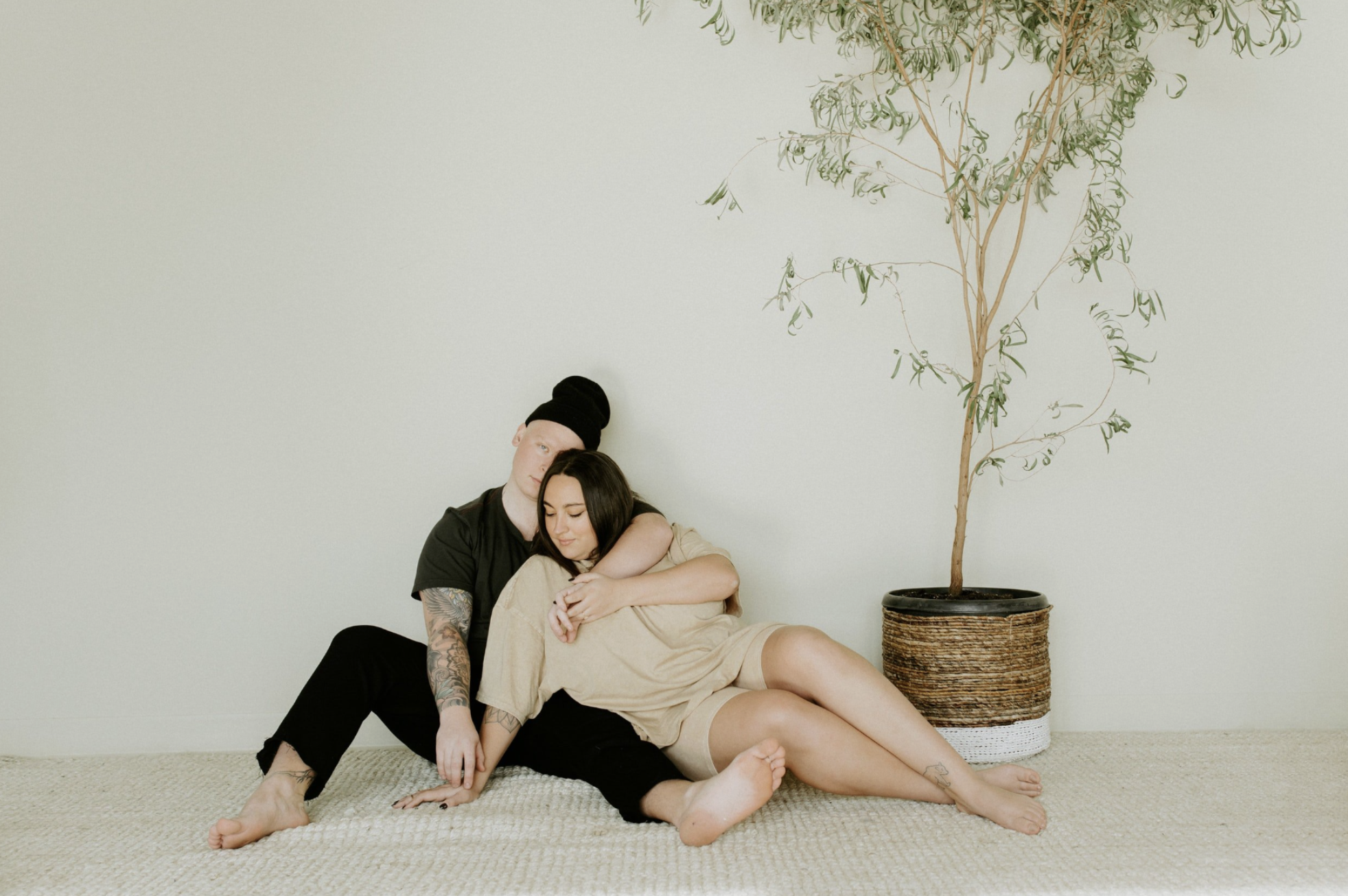 male and woman sitting on floor together - how to live peacefully with messy partner - gtwc - 2