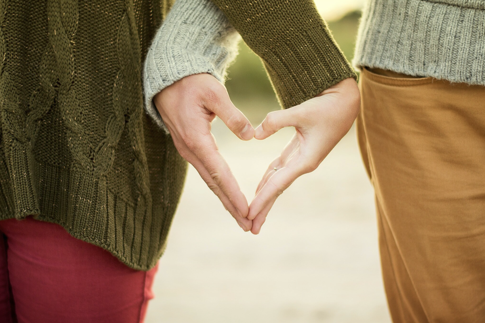 couple making heart shape with hands - gtwc sex therapy