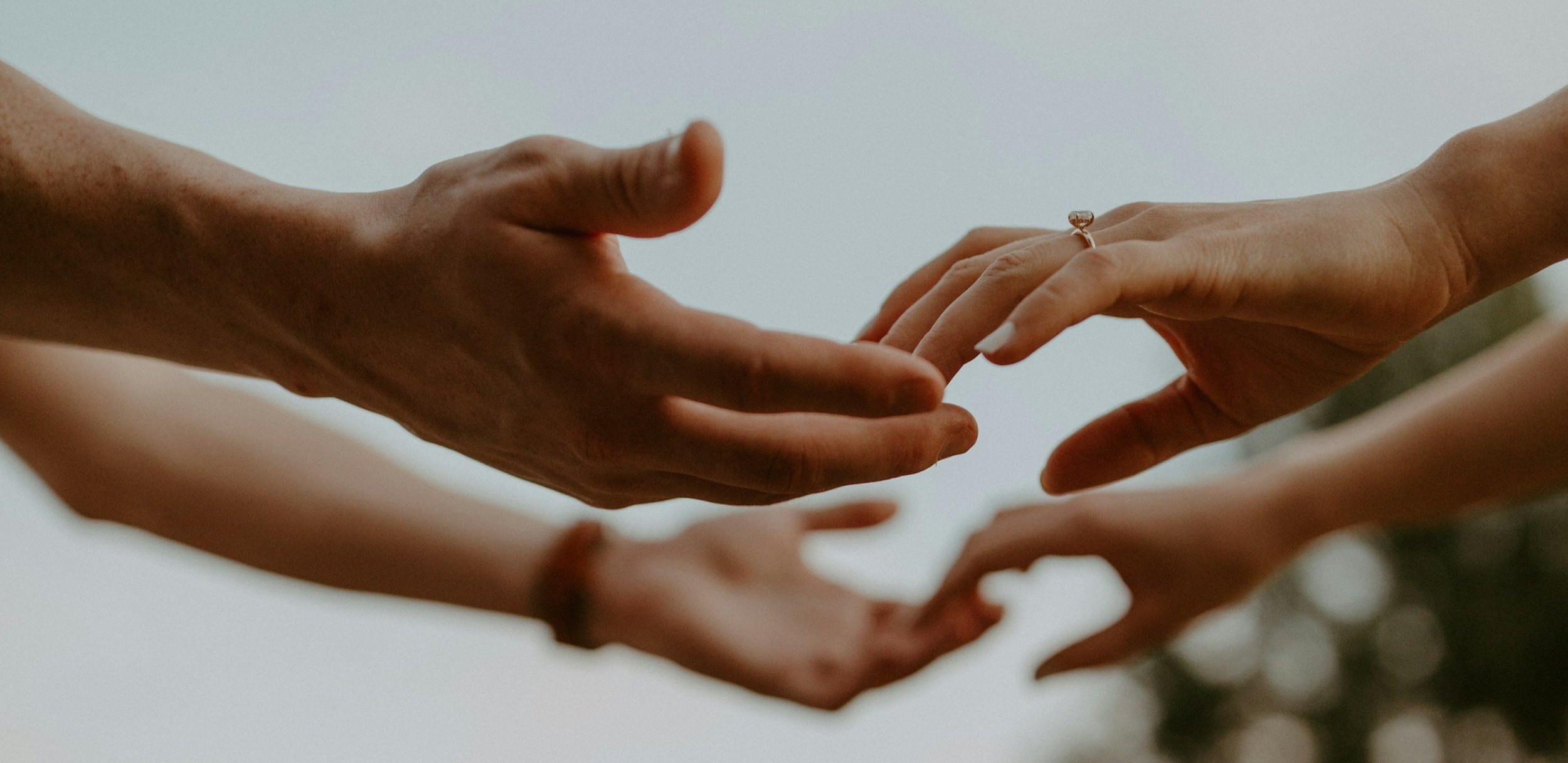 couple holding hands - sweat together connect deeper 