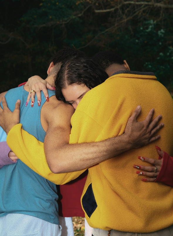 woman hugging two males - gtwc ask your therapist polyamory blog post