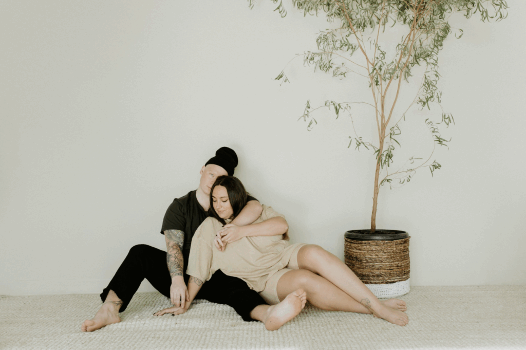 male and woman sitting on floor together - how to live peacefully with messy partner - gtwc - 2