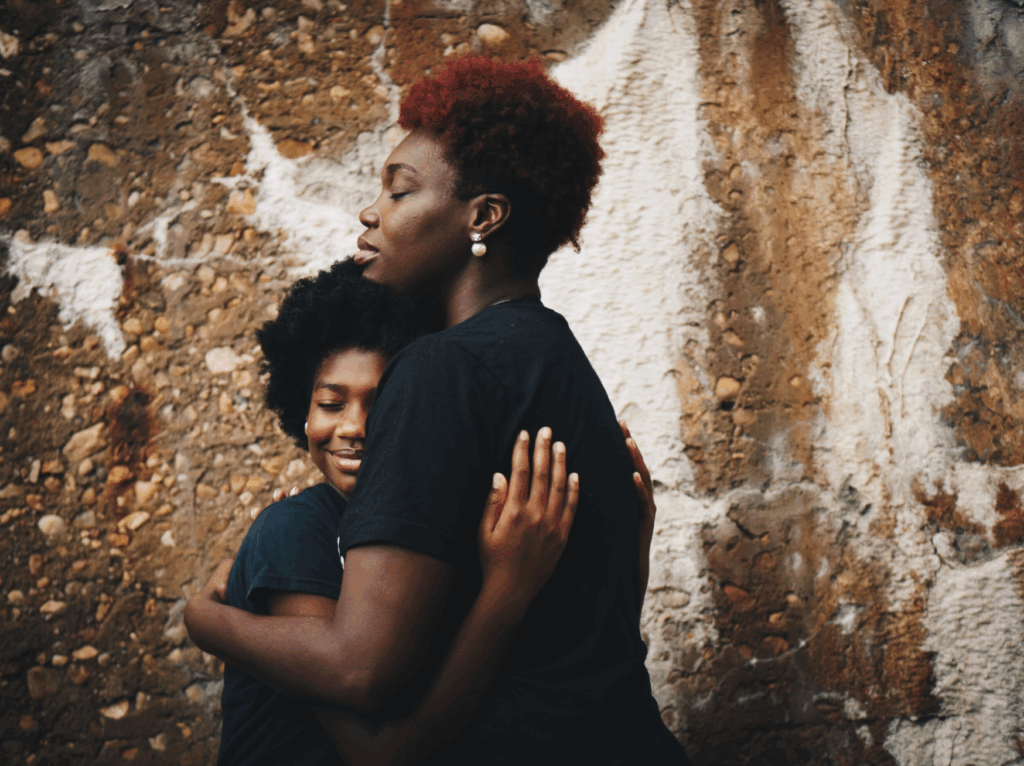 black mother/daughter hugging outside - gtwc black therapy